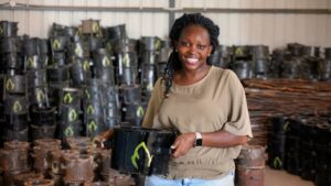 Charlot Magayi holds a Mukuru Clean Stove